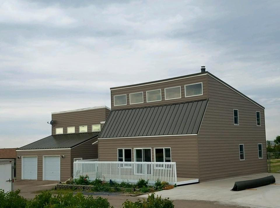House after completed metal roof job